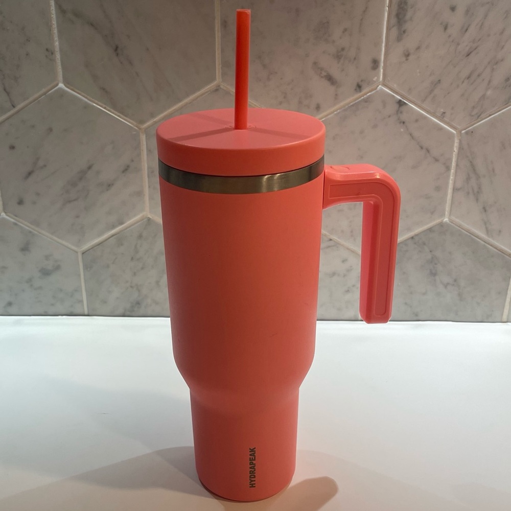 Coral or Salmon colored Hydrapeak 40oz Voyager Tumbler
